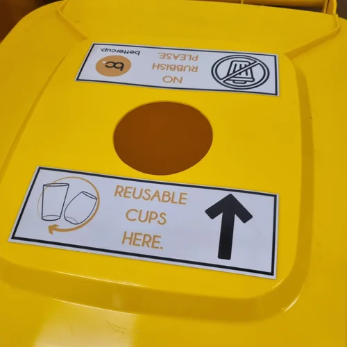 Bright yellow large bin for collecting reusable cups with a hole in the top specifically created for reusable cups by bettercup.