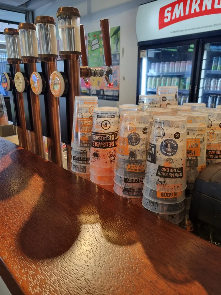 Stacks of reusable bettercup beer cups at Roundhouse UNSW bar, who replaced single use ups with reusable cups from bettercup and save thousands of dollars every year