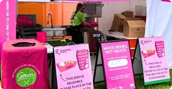 Pink bins and branded signage at the washing station at the Moomba Festival 2026