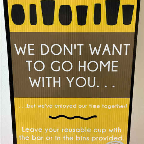 Yellow and black corflute sign for reusable events to place at bars and show patrons the cups are reusable and should be returned to the bars.