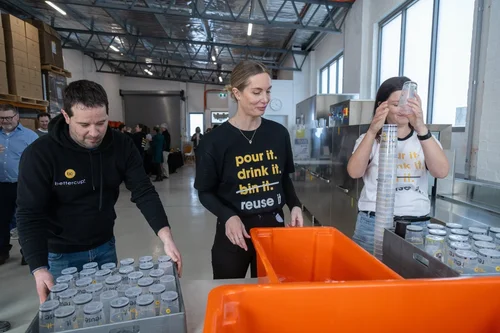 Bettercup team sorting reusable cups into collection bin at the Bettercup HQ.
