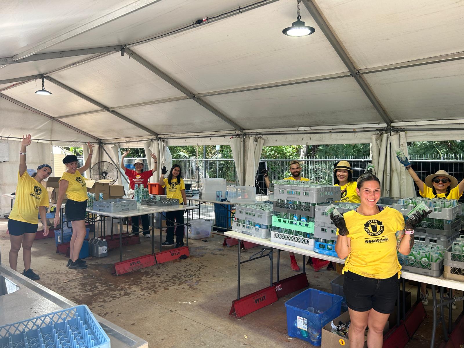 Happy staff members washing thousands of reusable cups at WOMADelaide festival