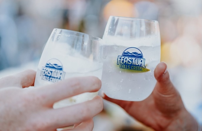 Two clear Custom printed stemless reusable cups with festival branding printed for festivals in Australia, Feastival FAlls Creek reusables program